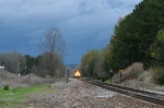 BNSF 9214 leads EB loaded coal train away from a storm